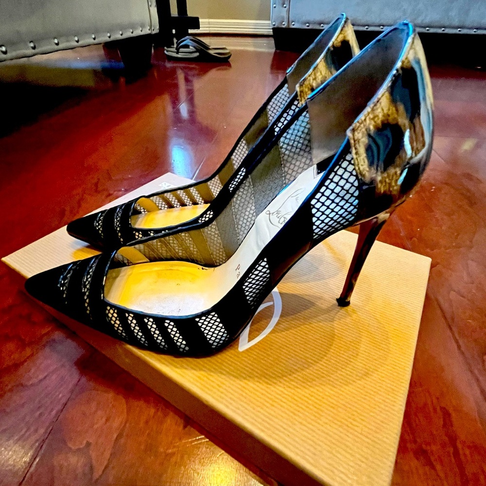 Christian Louboutin black pumps.